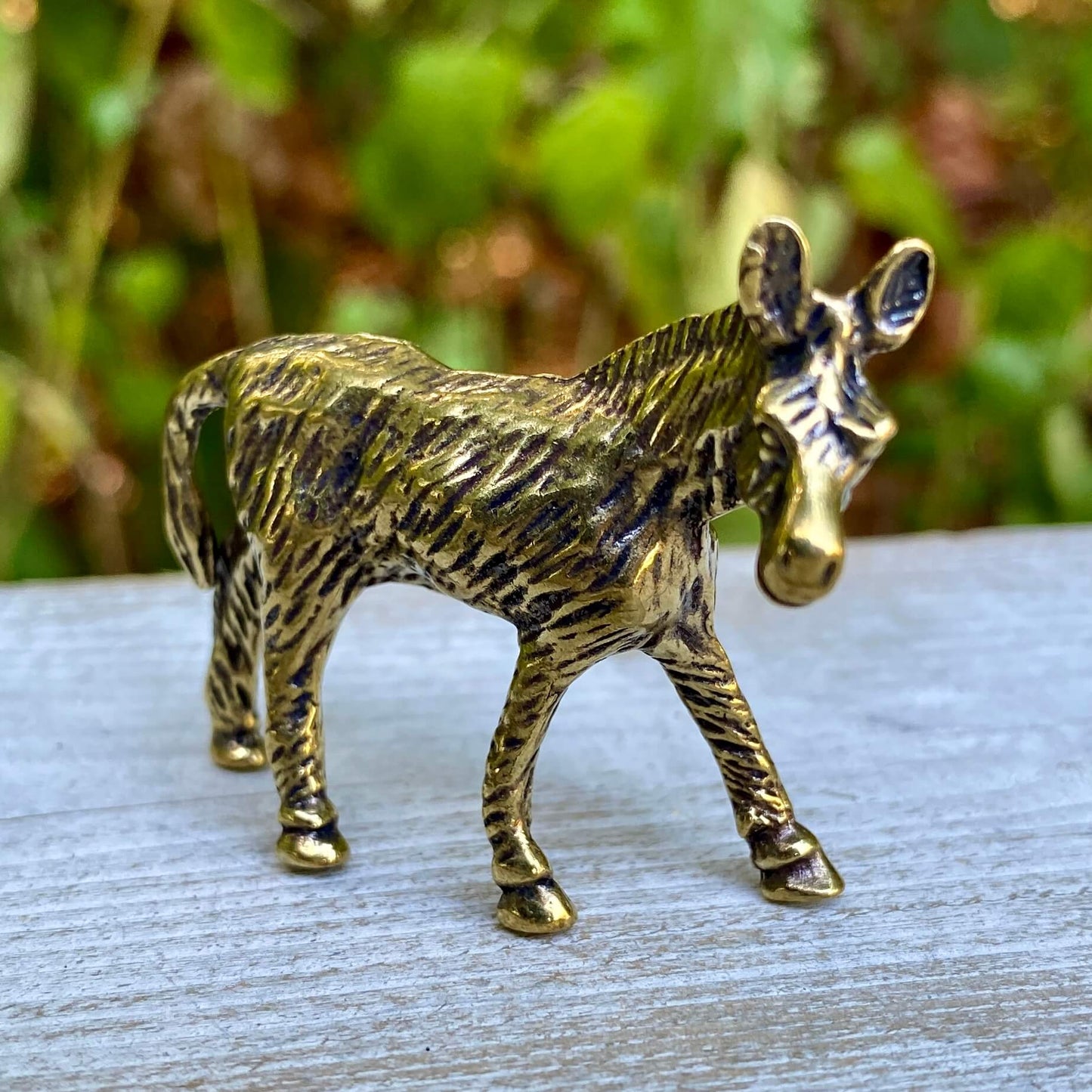 Solid brass donkey sculpture by Wild Brass, symbol of perseverance and humility, detailed view of the handcrafted figurine.