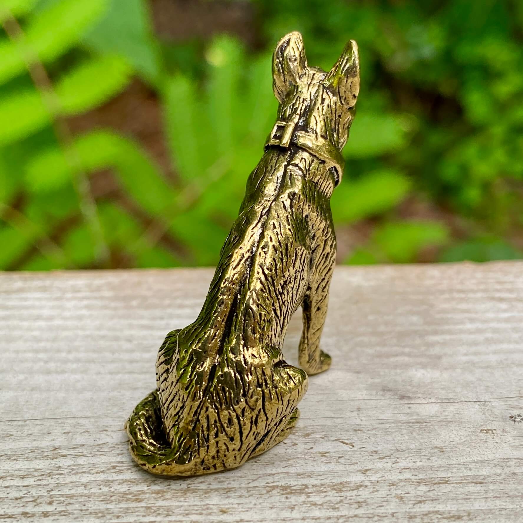 Solid brass German Shepherd sculpture by Wild Brass, symbolizing loyalty, courage, and protection, shown with detailed craftsmanship.