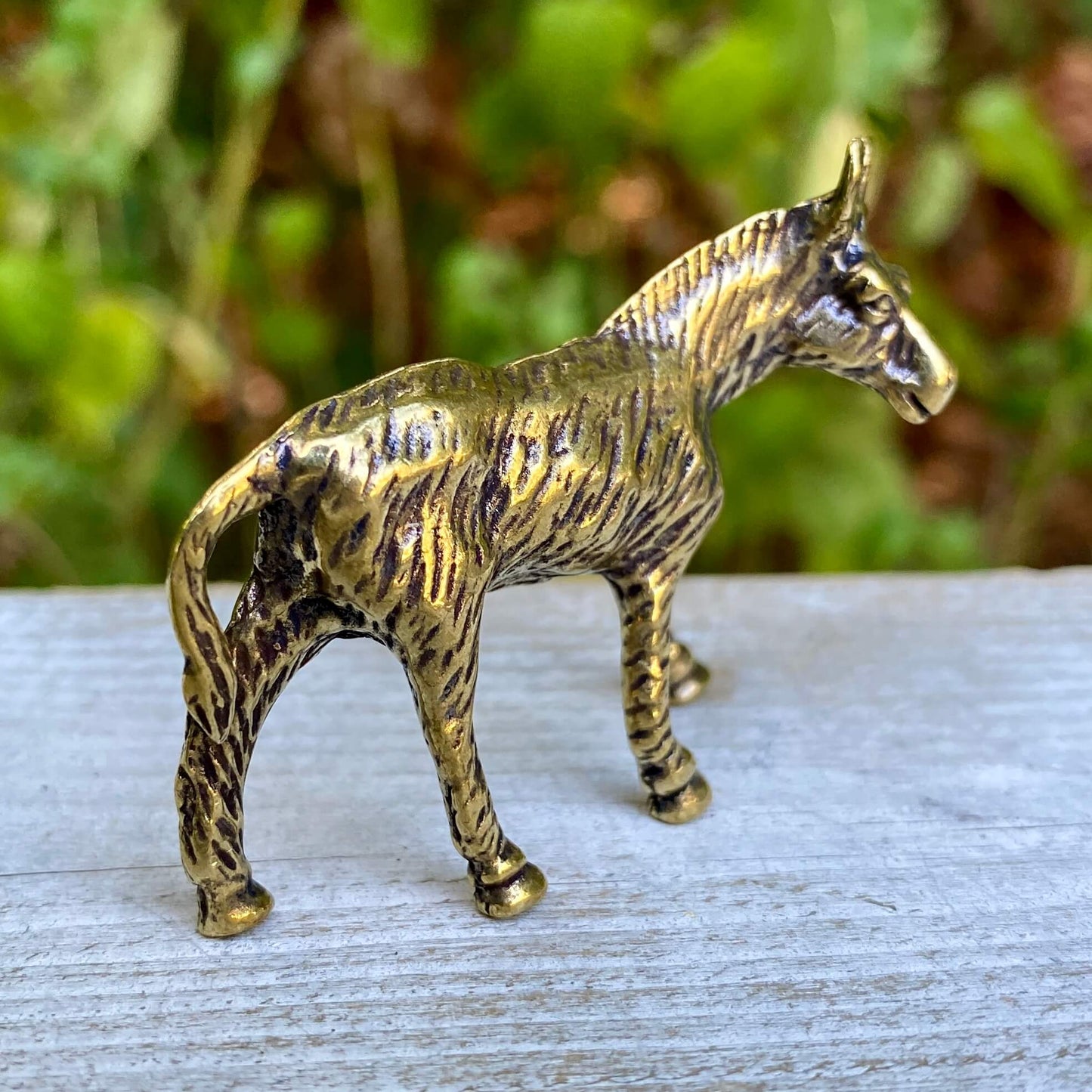 Solid brass donkey figurine by Wild Brass, symbol of perseverance and humility, detailed craftsmanship visible in the image.